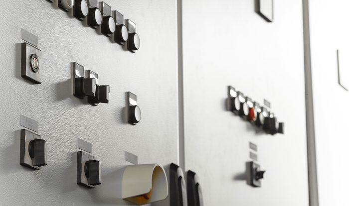 Hydropower plant control cabinet with switches and indicator lights